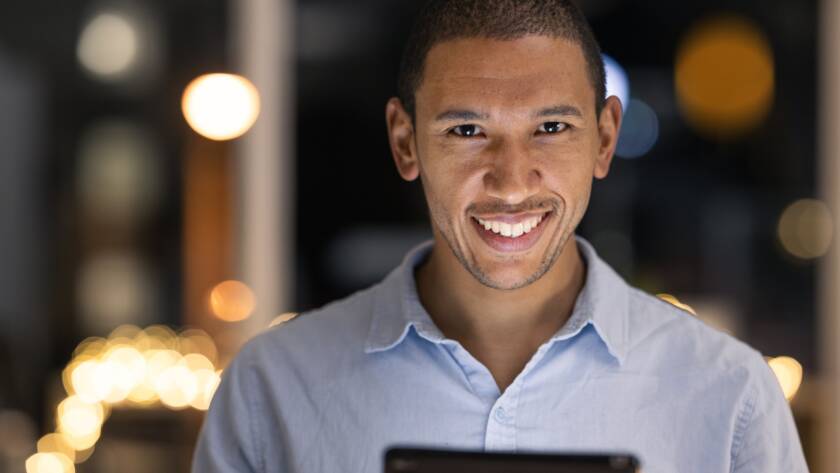 business man, tablet and happy portrait of a digital fintech employee at night with a smile. Financ